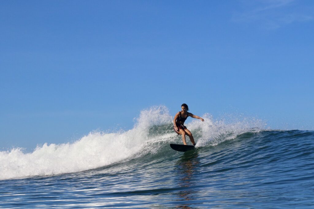 Surfer riding a clean open wave