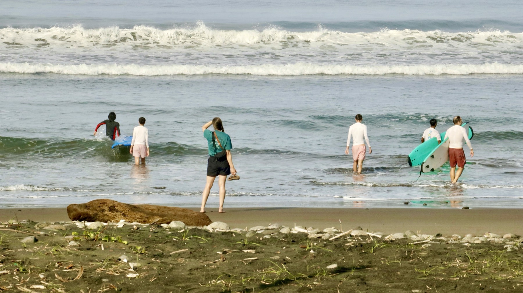 Beach briefing before a kids surf lesson